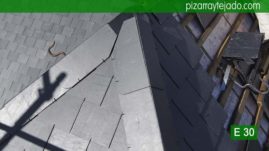Detalle de remate de aristas de pizarra natural con protección en aluminio. Tejado Villalba.
