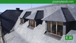 Preciosas mansardas en tejado rehabilitado de pizarra natural. Guadarrama pizarra.