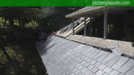 Pizarra E30. Ejecución de faldón de cubierta con canalón pesebrón en pizarra. Asturias pizarra.